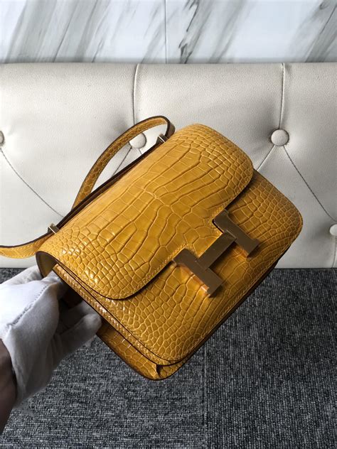 hermes jaune ambre shiny alligator constance|hermes constance lizard bag.